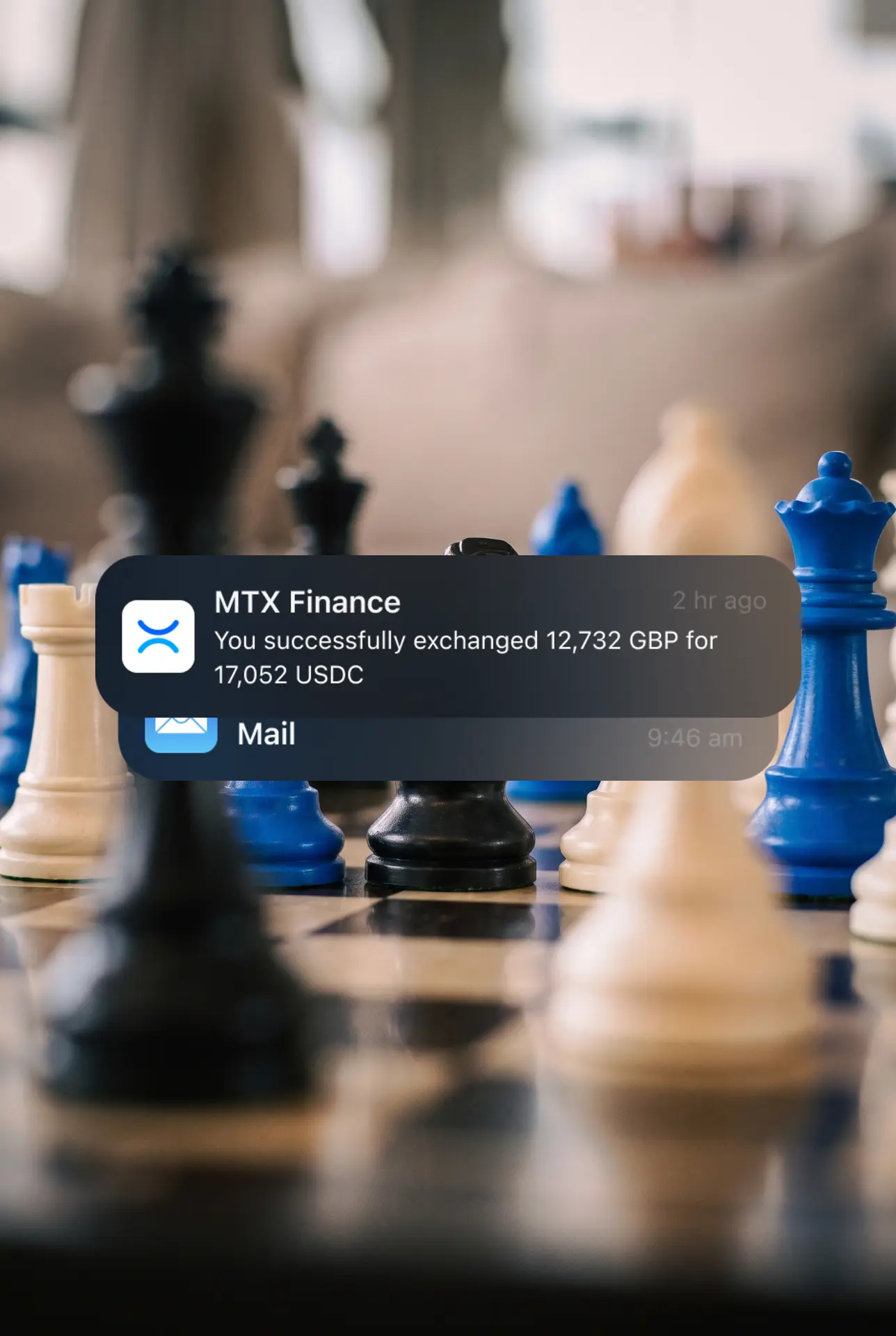 Blue and black chess pieces on a board with an MTX Finance exchange notification